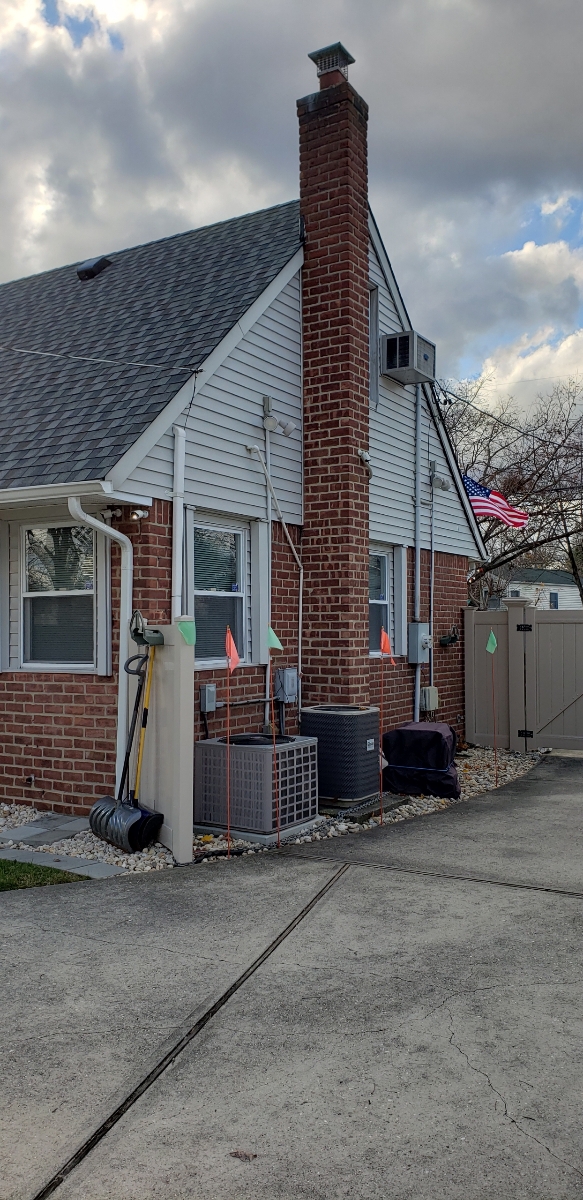 Professional chimney repointing restoring brick joints in Massapequa, NY